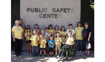 Noon Lions Club takes children on Police Department tour