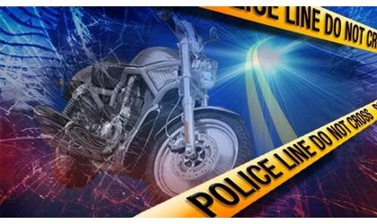 Man pushing motorcycle fatally hit by officer’s patrol car