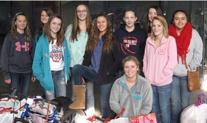 Girls’ tennis team gives gifts to Salvation Army