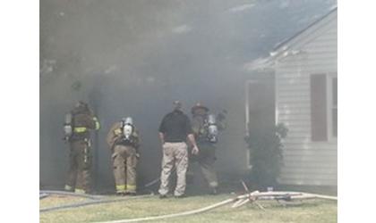 Firefighters battle house fire on South Birch