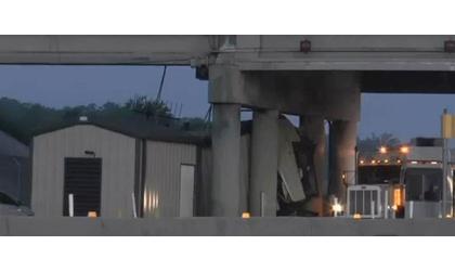 Tractor-trailer crashes into turnpike building
