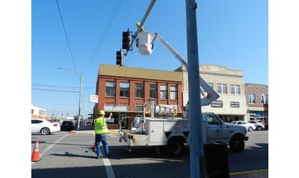 City crews replacing signal light poles and arms
