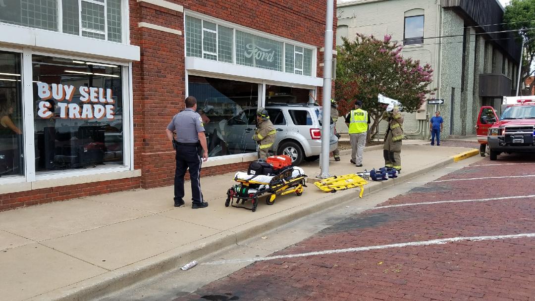 Car crashes into pawn shop
