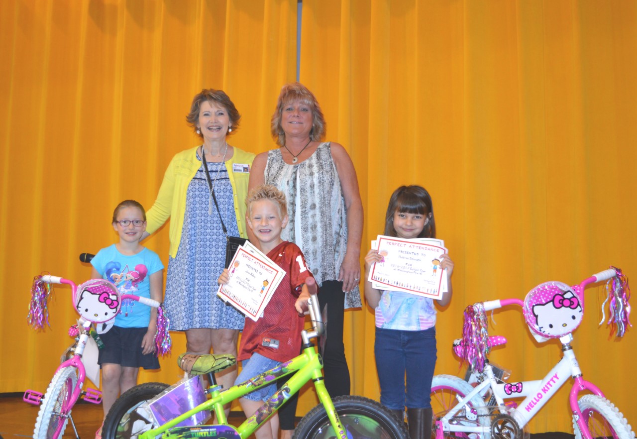 Prekindergarten students receive bikes for perfect attendance