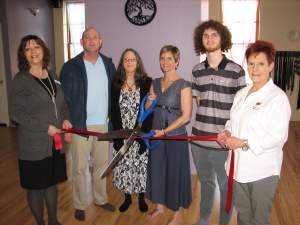 New owners of Om Yoga & Wellness Center cut ribbon