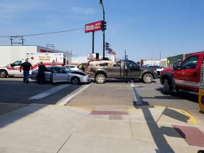 Car, truck collide at First Street and Grand Avenue