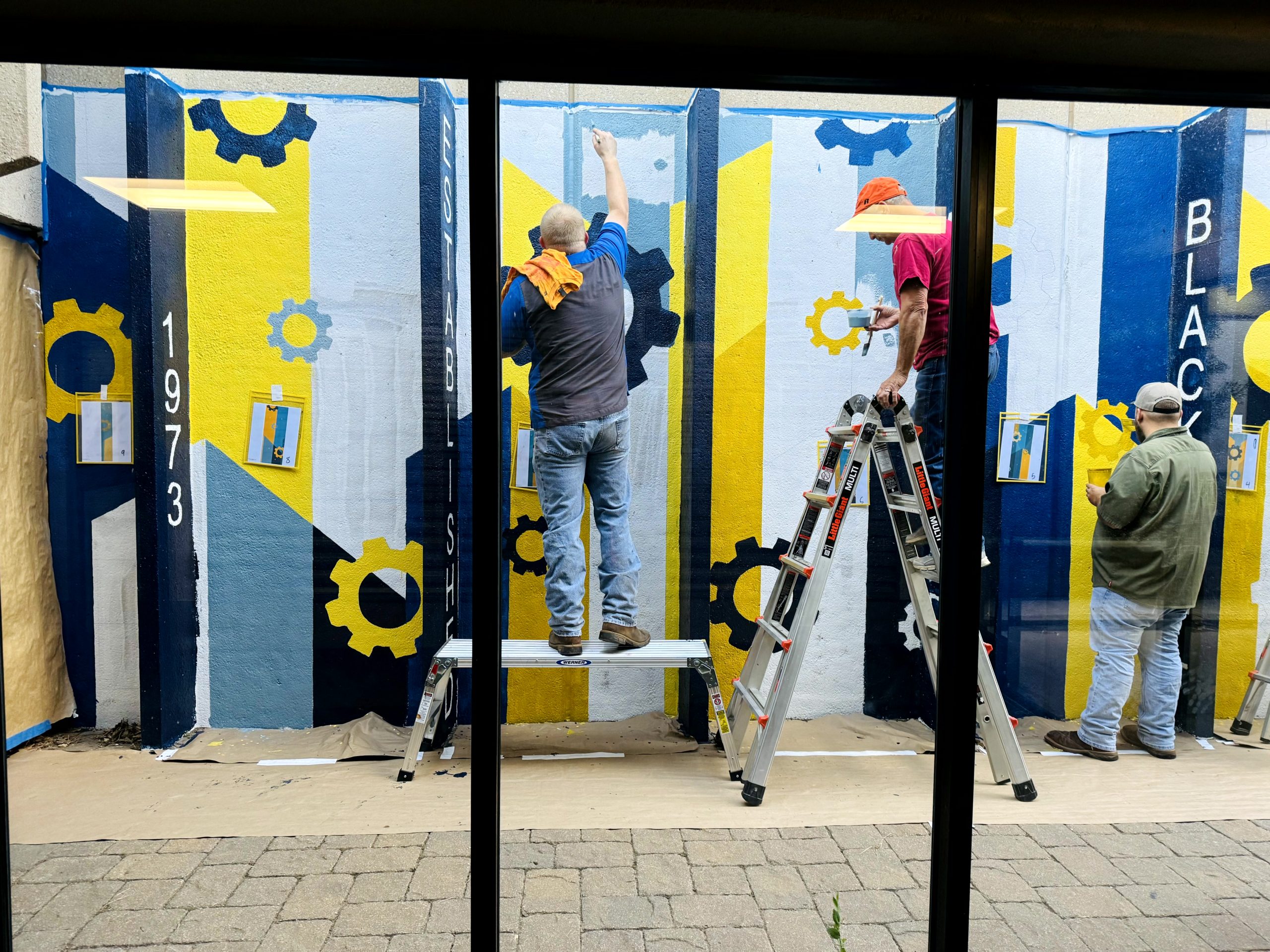 Pioneer Tech Employees Paint Mural With Local Artist